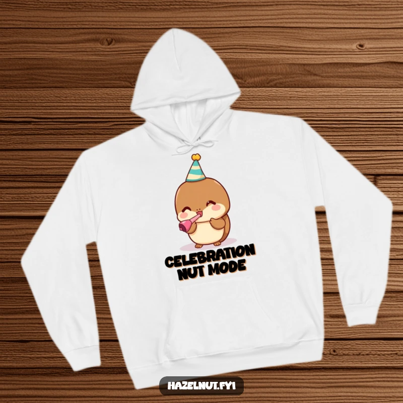 Funny hoodie featuring a happy kawaii hazelnut in a party hat blowing a noisemaker, a warm gift.