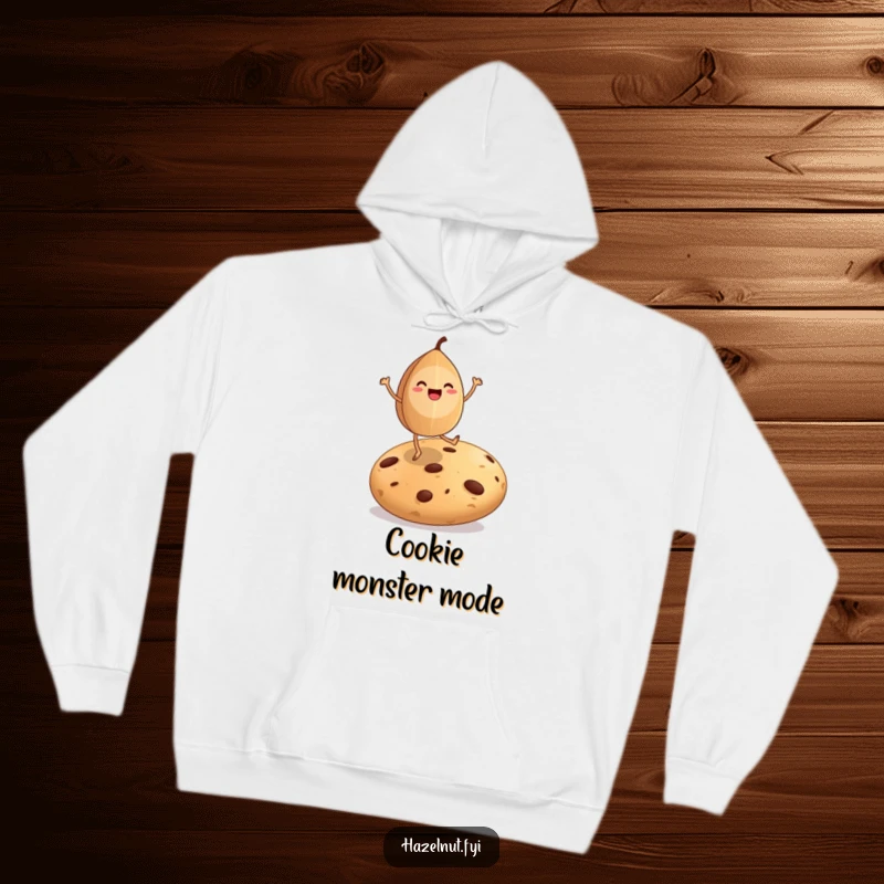 Funny hoodie featuring a happy hazelnut character with legs dancing on a giant cookie, exuding pure joy.