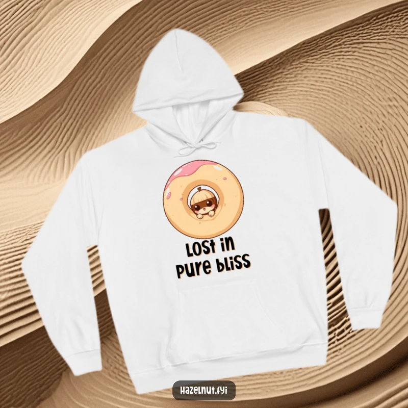 Funny hoodie depicting a curious hazelnut peeking from a giant, swirling doughnut, offering cozy and sweet amusement.