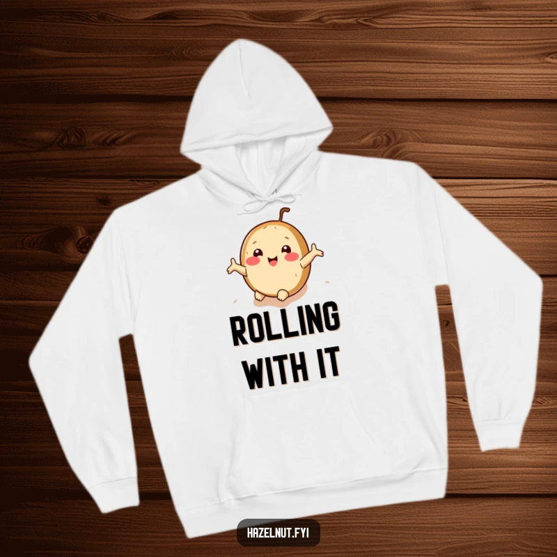 Funny hazelnut hoodie with arms outstretched, rolling downhill joyfully, offering warm, hilarious comfort.