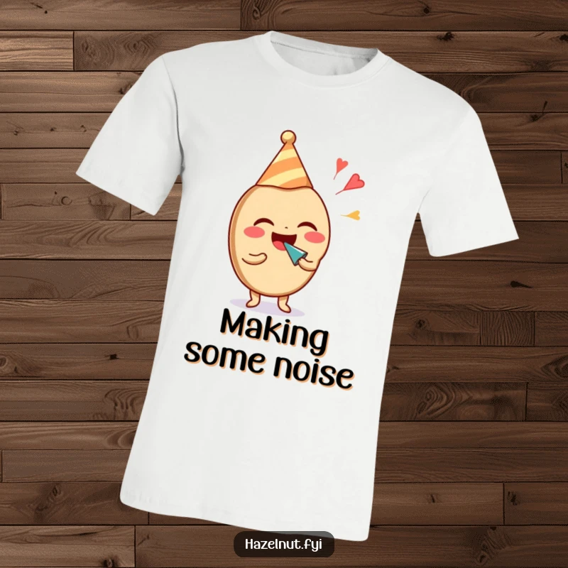 Funny hazelnut character in a party hat, laughing joyfully and blowing a noisemaker. A fun, funny t-shirt.
